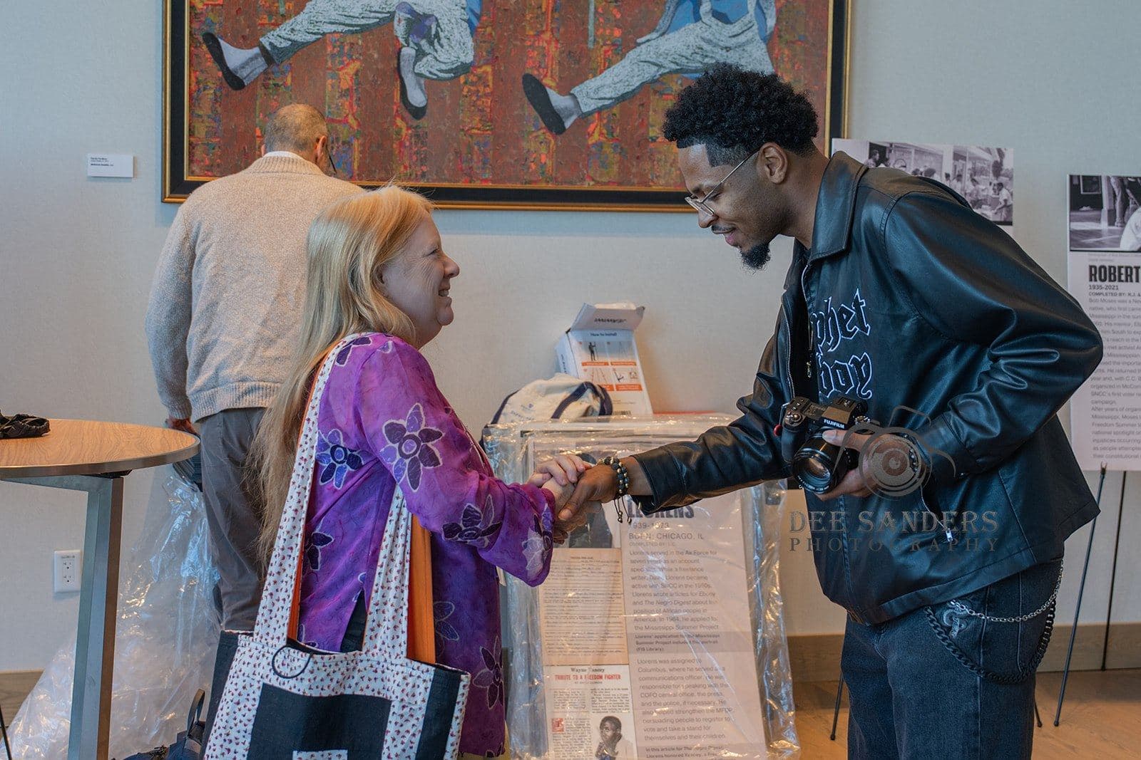 Attendees greeting one another at the Friday welcome