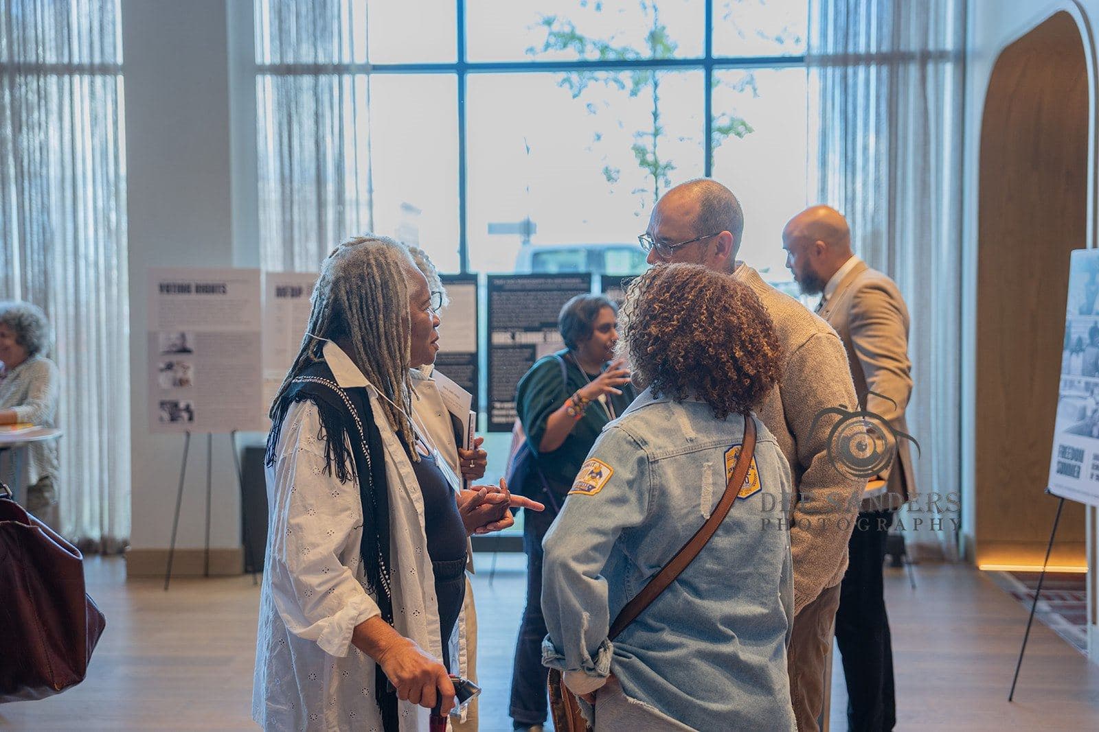 Conversation among attendees in the lobby