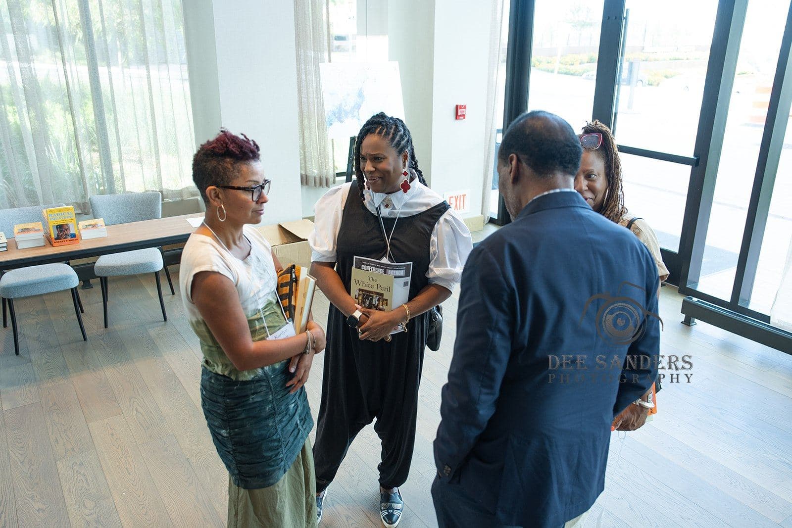 Attendees sharing a moment in the lobby