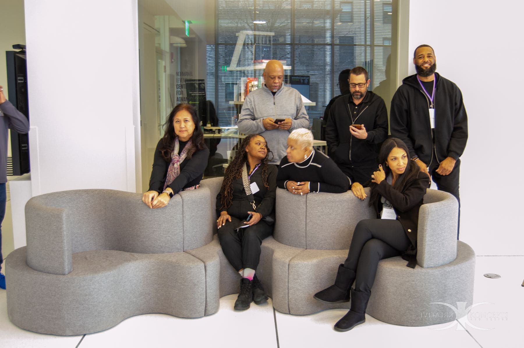 A large group posing together on couches