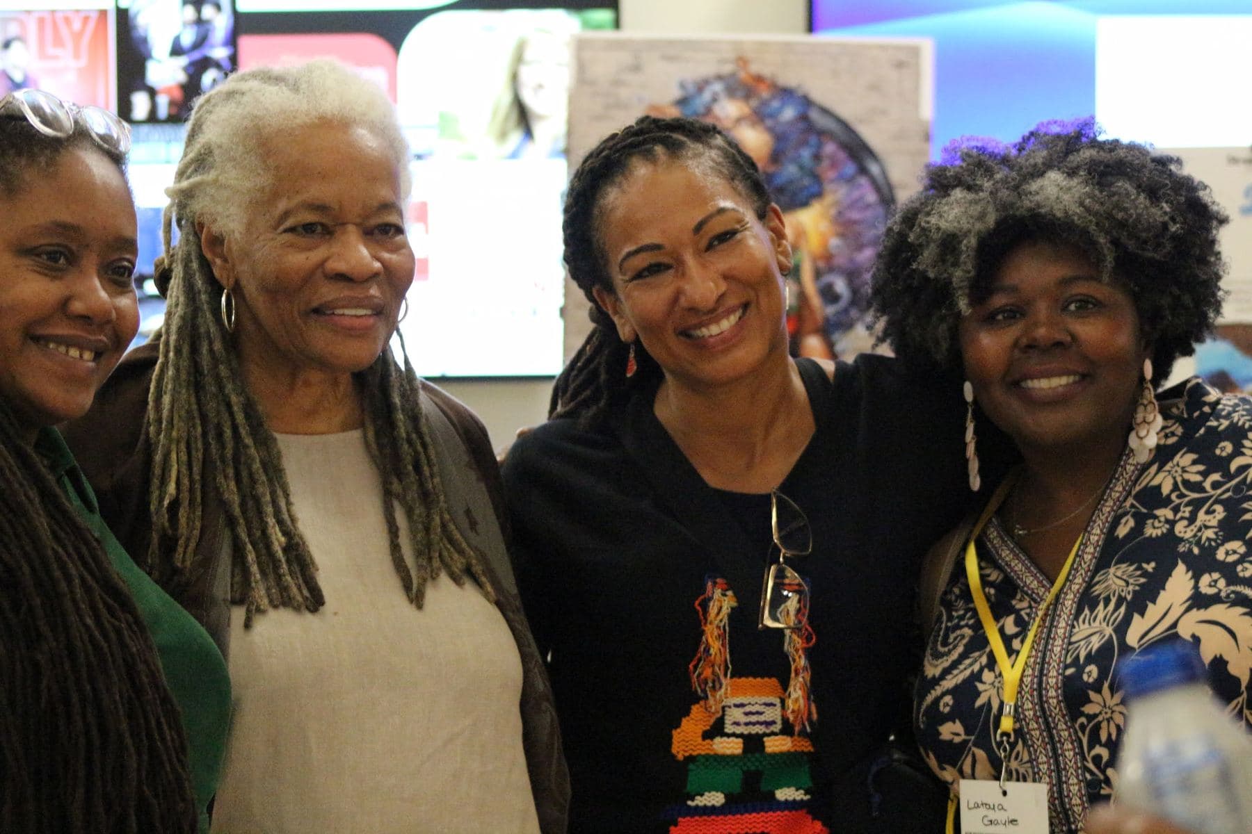Attendees smiling together between sessions