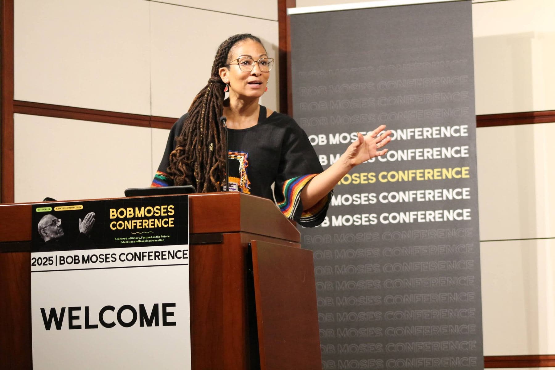 A speaker at the welcome podium