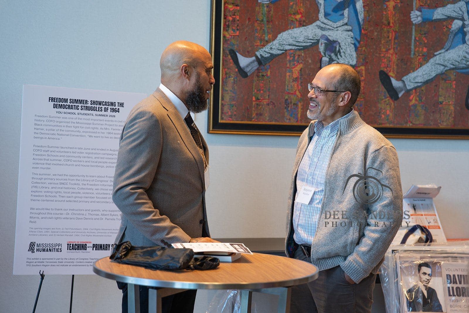 Two attendees in conversation at the Friday welcome